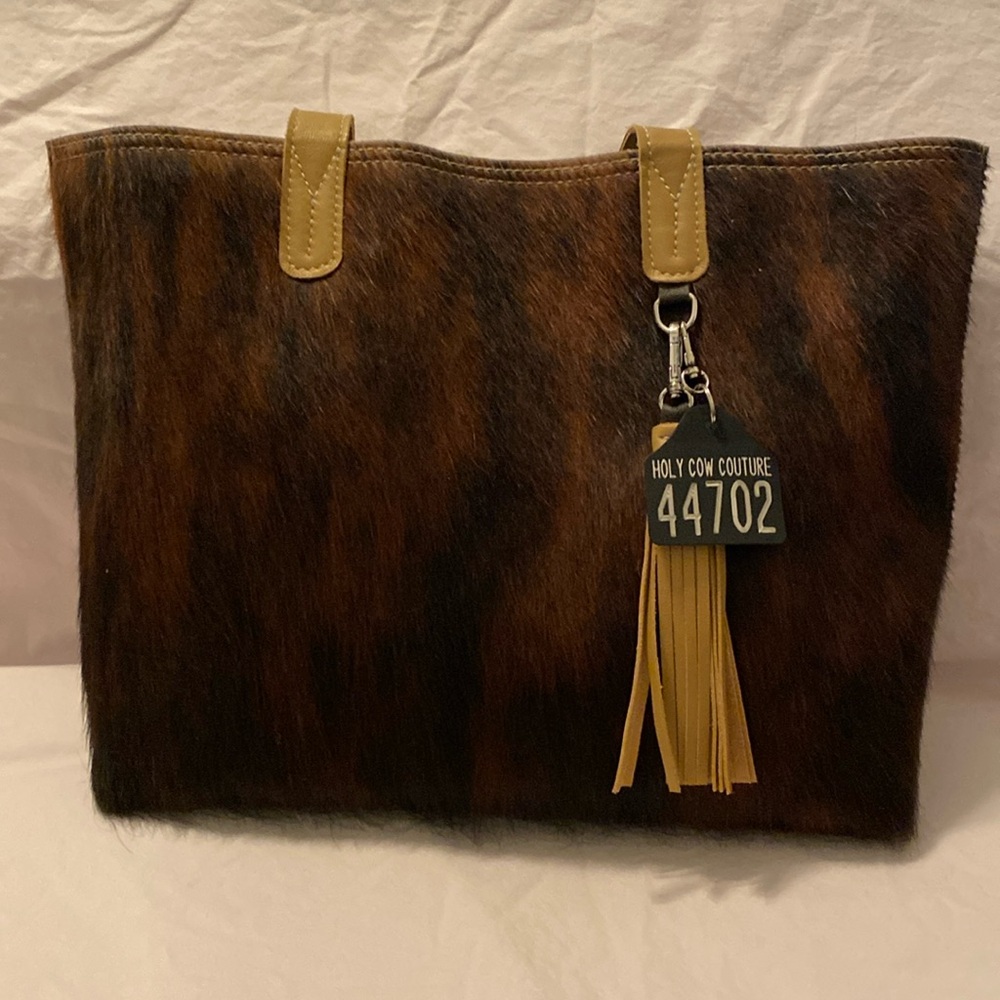 Holy Cow Couture Hair on Hide Weekender w/ Leopard leather pocket on back.